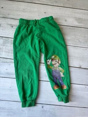 5/$25 H&M Green Luigi Graphic Sweatpants for Kids - Super Mario
